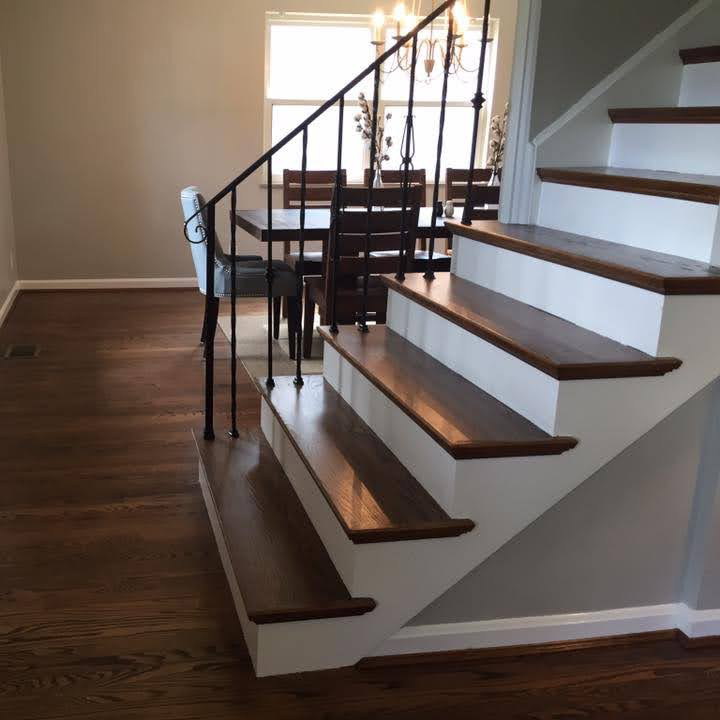 Lvp on stairs whit white risers - RE Flooring, Llc